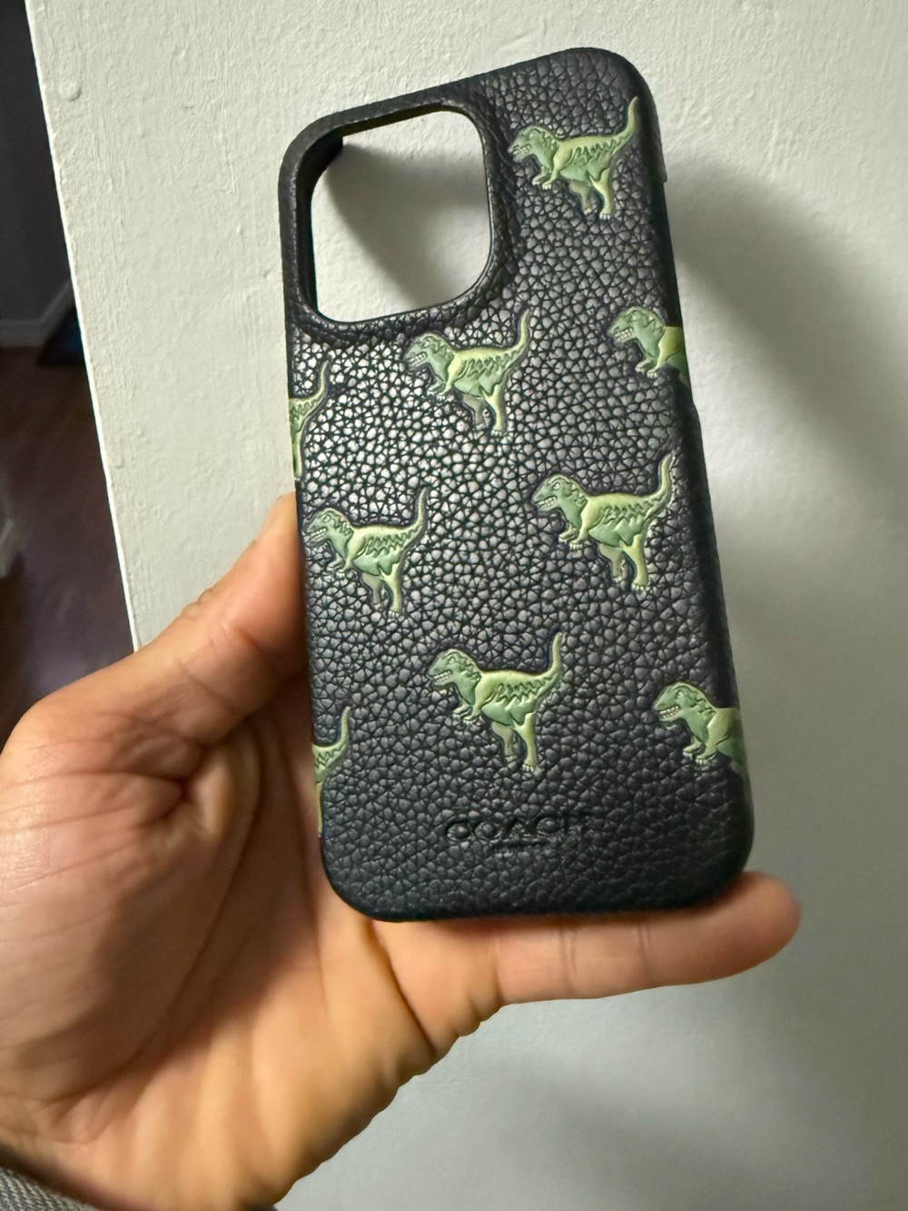 Coach Black Leather iPhone 16 (not pro) Case with Green Dinosaur Print
